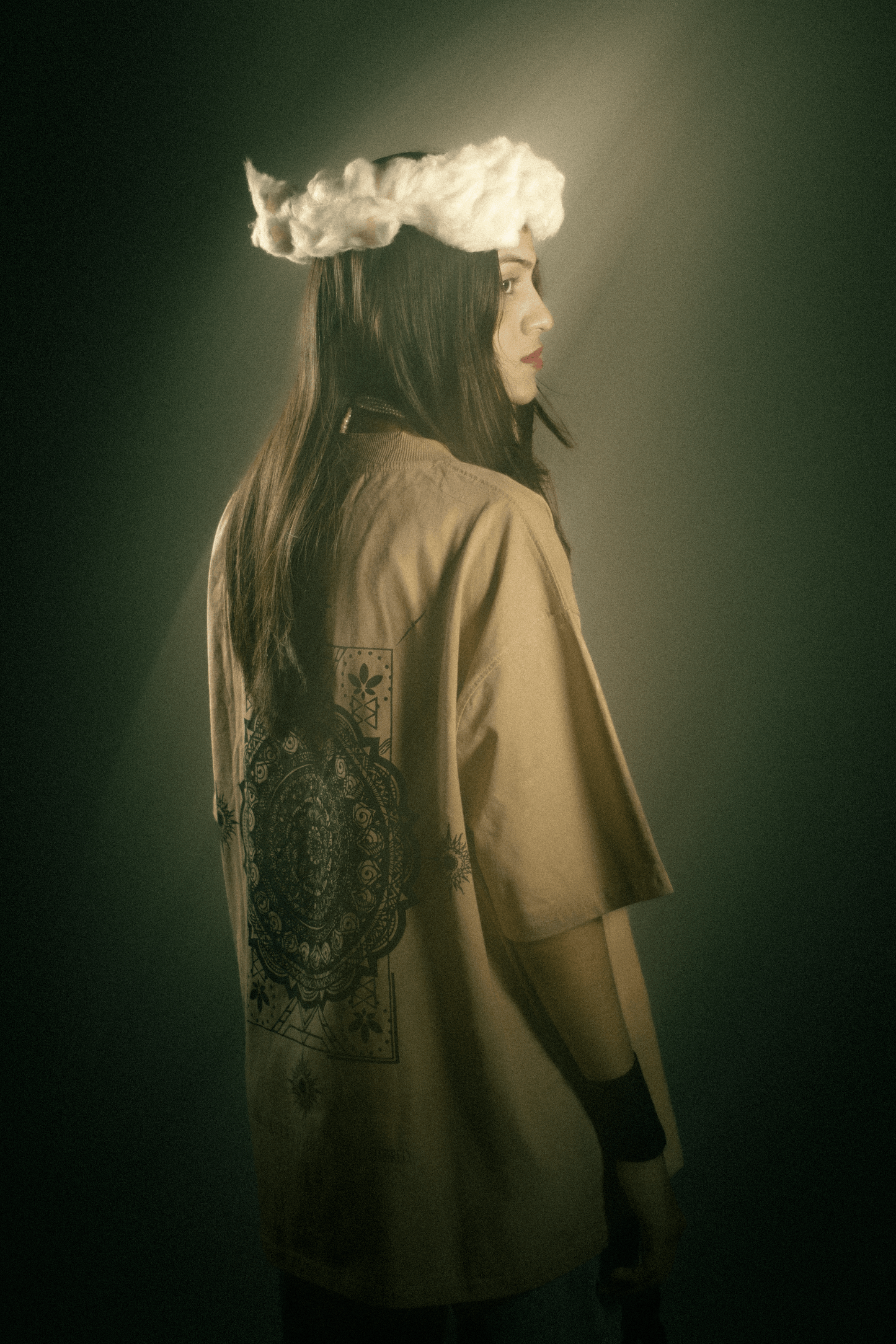 Model wearing beige oversized graphic t-shirt Elysium premium streetwear India