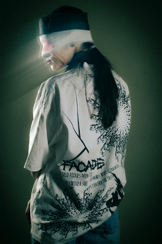 Person wearing a white t-shirt with black graphics and text against a dark background White oversized graphic t-shirt for men/women premium cotton luxury streetwear India