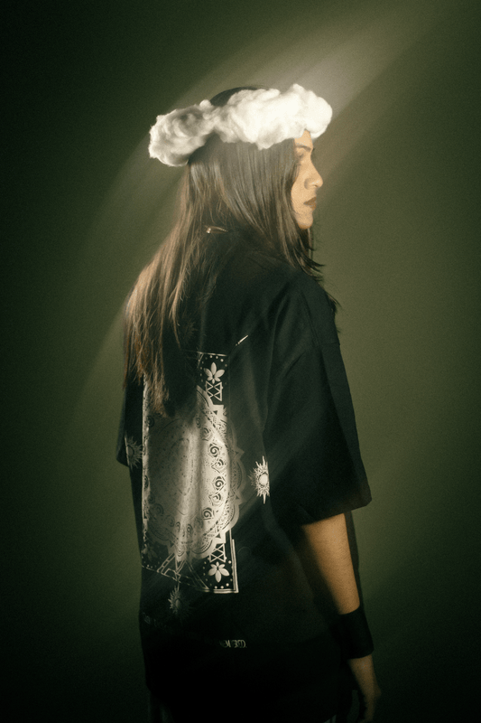 Model wearing black oversized limited edition Elysium t-shirt premium streetwear India