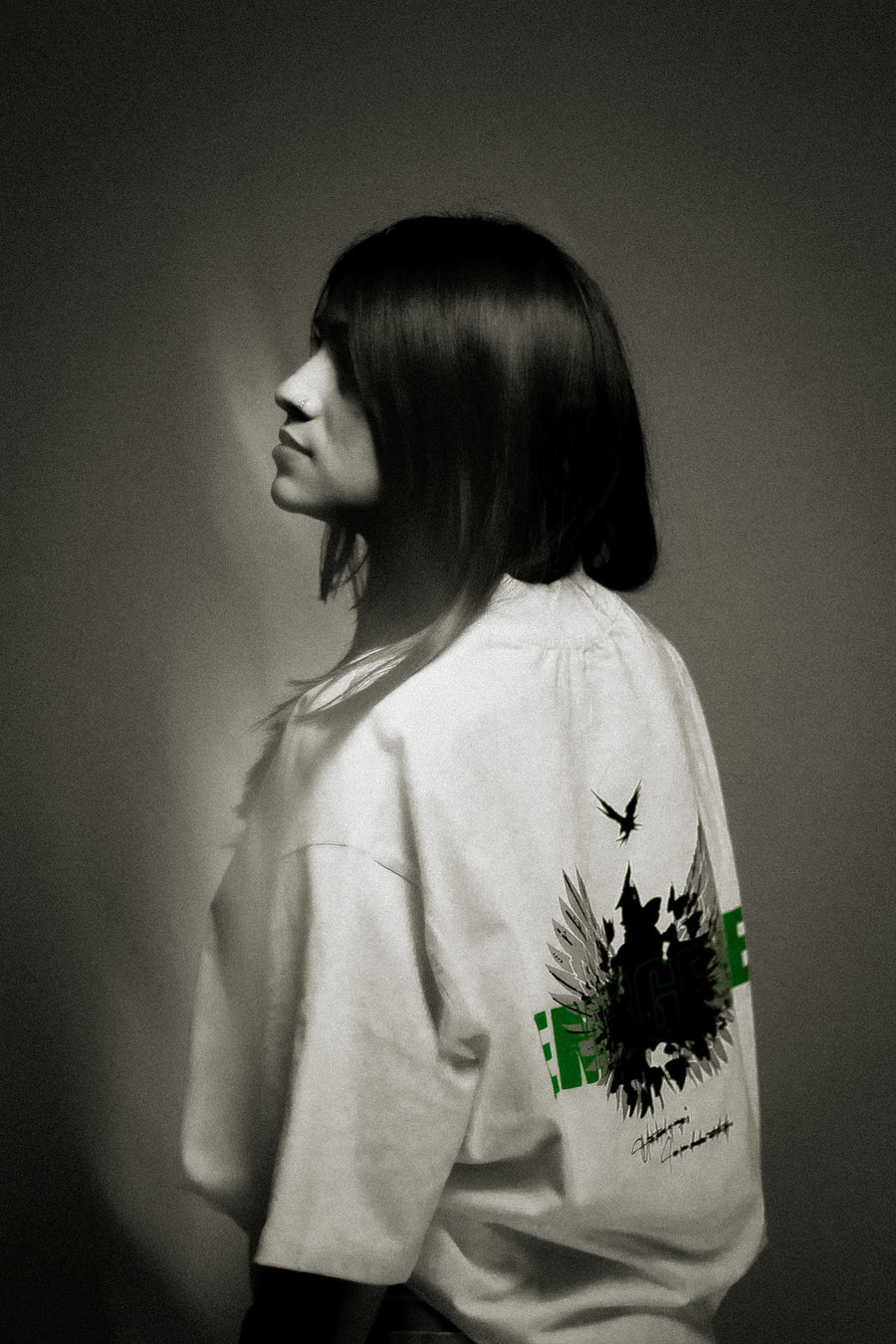 Model wearing Limited Edition White Oversized Graphic T-Shirt - Premium Dark Luxury Streetwear | YTHRAL©